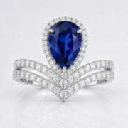 2.74ct sapphire statement ring with pear-cut blue sapphire and double pavé halo