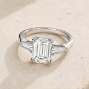 Woman wearing SIGLO 3ct emerald-cut lab-grown diamond ring
