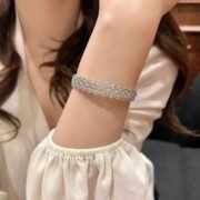 Woman wearing SIGLO sterling silver bracelet with elegant everyday style