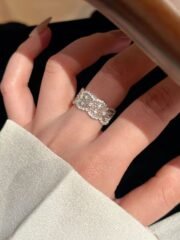 Hand wearing SIGLO multi-row sparkling sterling silver ring
