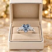 Side profile of a heart diamond ring with trillion side stones