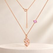 Rose gold paw pendant necklace side profile and setting details