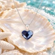 Faceted blue heart pendant necklace detail