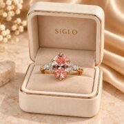 Oval Pink Diamond Ring displayed in a romantic luxury setting