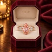 Floral pink diamond ring displayed in a romantic luxury scene