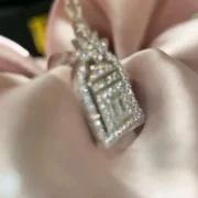 Angled view of the Door to Happiness pendant with lab-grown diamond pavé