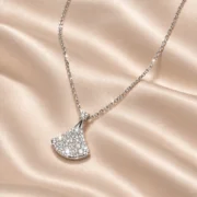 Angled view of the Ginkgo Glow lab-grown diamond fan pendant