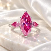 Rosé Promise pink marquise diamond ring displayed on ivory satin