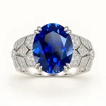 Oval blue gemstone ring with petal-like prongs and sparkling geometric shoulders