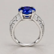Side profile of the blue gemstone ring showing its wide band and geometric stone settings