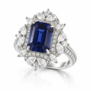 45-degree view of an emerald-cut blue sapphire halo ring