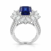 Side profile of blue sapphire statement ring with raised halo setting