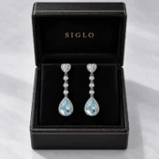 Sky Serenade natural blue topaz dangle earrings presented in a SIGLO jewelry gift box