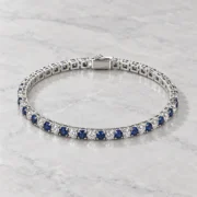 Angled view of the silver settings and alternating round stones on the Midnight Promise bracelet
