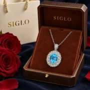 Azure Heart blue topaz halo necklace presented in a SIGLO jewelry gift box