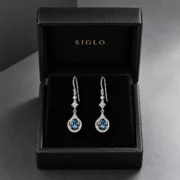 Twilight Dew natural blue topaz drop earrings presented in a SIGLO jewelry gift box