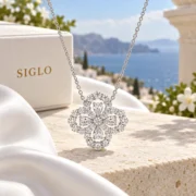 Luminous Luck diamond clover pendant and fine silver chain arranged in an elegant jewelry display