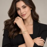 Gold-tone pavé snake bangle in a styled jewelry display