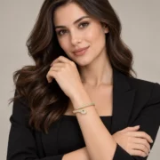 Gold-tone pavé snake bangle in a styled jewelry display