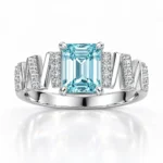 SIGLO light blue emerald-cut ring with silver-tone zigzag band, front view