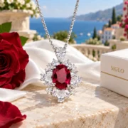 Crimson Flame red ruby pendant and sterling silver chain arranged in an elegant jewelry display