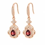 Front view of SIGLO Golden Ember gold plated garnet earrings