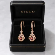 Golden Ember garnet earrings presented in a SIGLO gift box