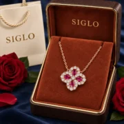 Crimson Wish ruby four leaf clover necklace presented in a SIGLO jewelry gift box