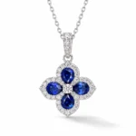 Sapphire clover necklace with four deep blue pear-shaped stones and sparkling halos in S925 silver