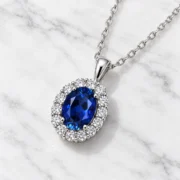 Sapphire halo necklace with an oval deep blue center and lab-grown diamond accents in S925 silver