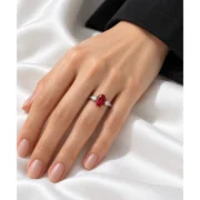 Scarlet Devotion red three stone ring worn on the hand