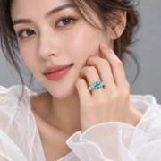 Blue-green floral ring displayed against a dark background
