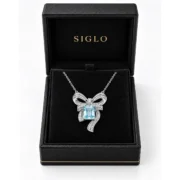 Azure Ribbon blue topaz bow necklace presented in a SIGLO gift box