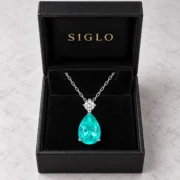 Mermaid Tear teal teardrop necklace presented in a SIGLO jewelry gift box