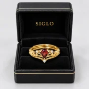 Crimson Reign two-piece garnet crown ring set presented in a SIGLO gift box