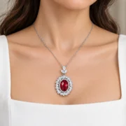 Model wearing the Crimson Muse oval ruby pendant on a 17.72-inch chain